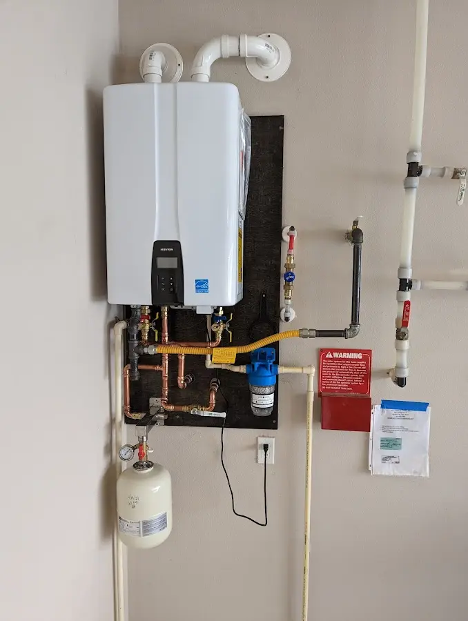 Professional plumber installing copper piping in a Daytona Beach Shores home